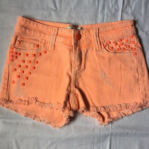 Daytrip/Buckle orange shorts.